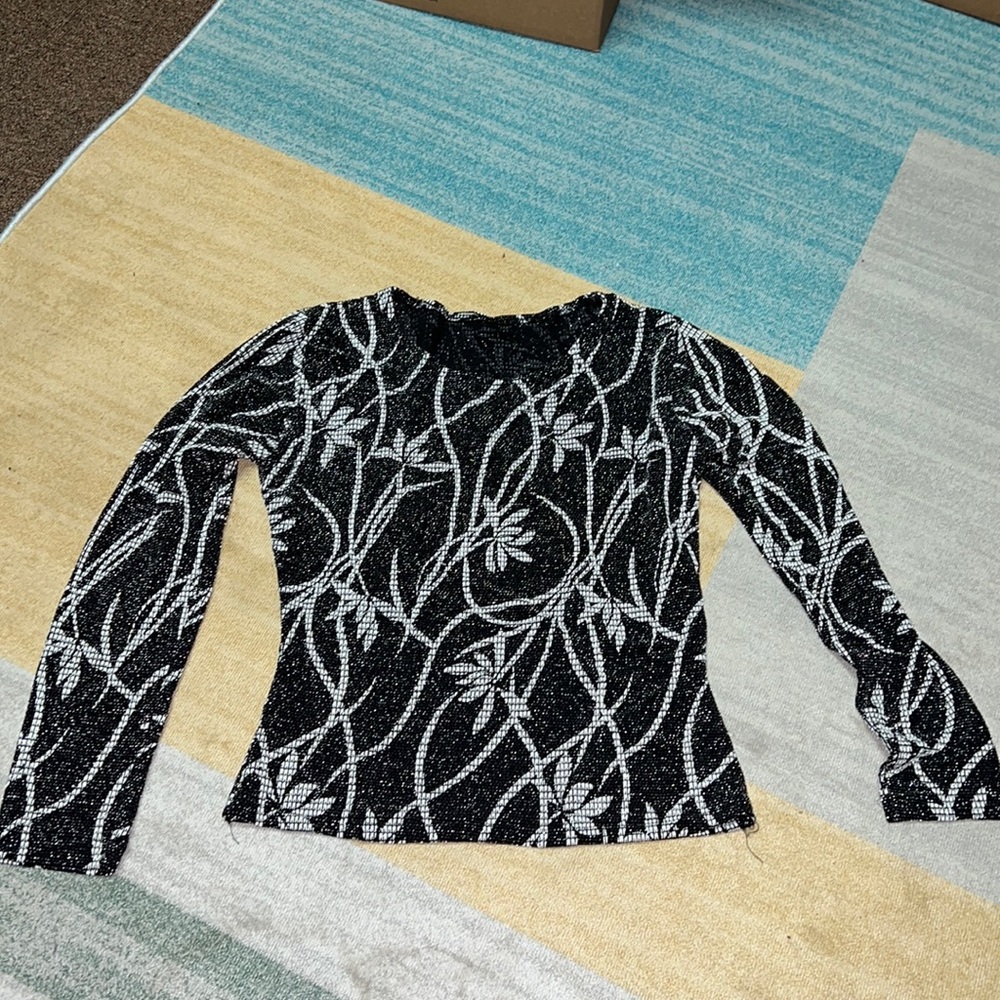 Black and white long-sleeved top with silver metallic threads
